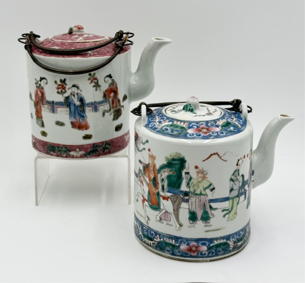 Pair of Vintage Chinese Hand Painted Tea Pots: Pair of vintage Chinese tea pots. Both feature hand painted figure stories and floral motifs. Double metal overhead handles. Stamped bottoms. Both in great condition for age with no chips or cracks. A