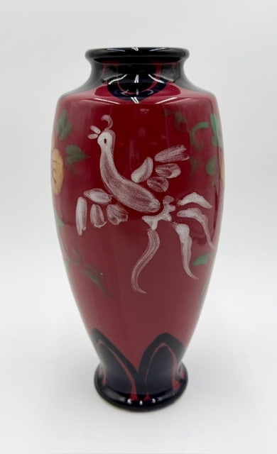 Vintage Japanese Lacquer on Porcelain Vase: Beautiful vintage Japanese lacquer on porcelain vase. Vase features a vibrant red ground decorated with hand painted motifs including a bird and flowers. In excellent condition with no chips or cracks