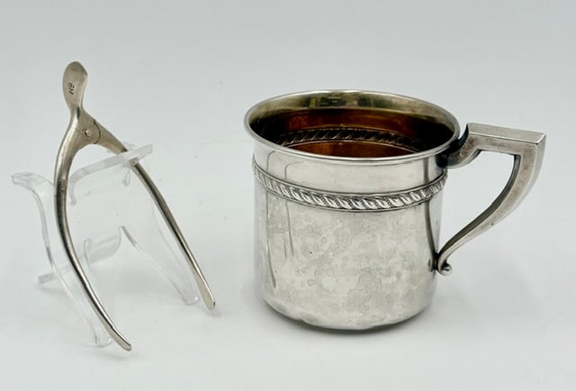 Sterling Silver Cup and Sugar Tongs - 2.1oz TW: Pair of sterling silver collectibles. Includes 2.5" baby cup and 3.5" wishbone sugar tongs. 2.1oz TW. Photos are considered part of the condition and description. R