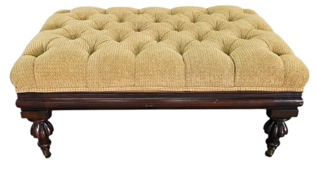 Henredon Style Tufted "Berkley" Cocktail Ottoman: Henredon style tufted "Berkley" cocktail ottoman. Ottoman features a hardwood frame, tufted upholstery, and turned legs on brass casters. Some unfinished wood near upholstery seams. Approximately