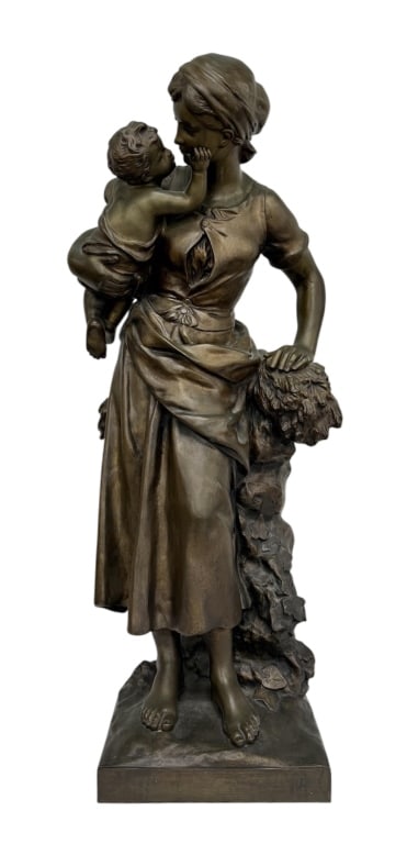 Mathurin Moreau "Mother & Child" Bronze Sculpture: Mathurin Moreau "Mother and Child" bronze sculpture. Hollow cast. Sculpture depicts a mother holding her child. Heavy. Approximately 23.5"h x 8.25"w x 8"d. Photos are considered part of the condition 
