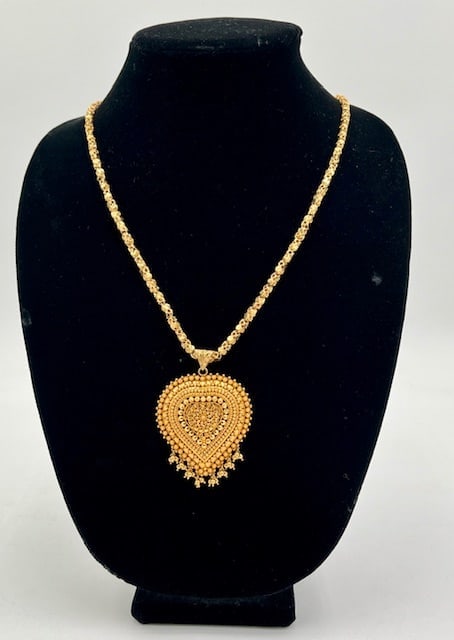 21k Egyptian Medallion Pendant On Chain -54.3g: 21k (.875) Egyptian Medallion Pendant On Ornate Box Style Chain. 54.3g combined weight. Pendant Approx. 2.75" H X 2"W. Chain Approx. 30"L. Marked PP - Eastern Arabic Hallmark. Photos Are Considered Pa