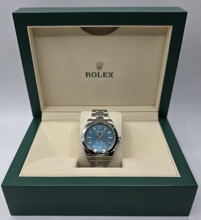 Rolex Milgauss Z-Blue 40mm Watch: Rolex Milgauss Z-Blue wrist watch. Model number 116400GV, Serial number 210R3021. 40mm Stainless steel case. Discontinued by Rolex in 2023. Watch features iconic green sapphire crystal with orange lig