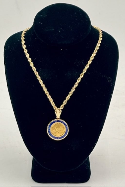 Chinese .999 Gold Coin on 14k Chain - 6.7g TW: Chinese .999 gold coin set in 14k lapis pendant on 14k chain. 6.7g TW. Chinese 1/20oz 5 Yuan .999 fine gold panda coin set in 14k lapis pendant. 4.3g TW. Approx. 1.25"L. Hung on 14k 16" Rope chain. 2.