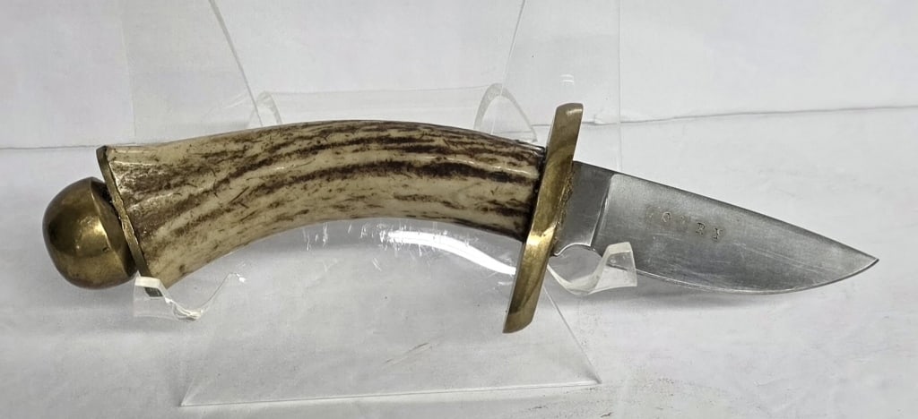 Lowry Stag Handle Skinner Knife: Lowry skinner knife. Knife features a genuine stag handle, a brass guard, a polished fixed blade, and brass butt. Approximately 8"long. Photos are considered part of the condition and description. R#1
