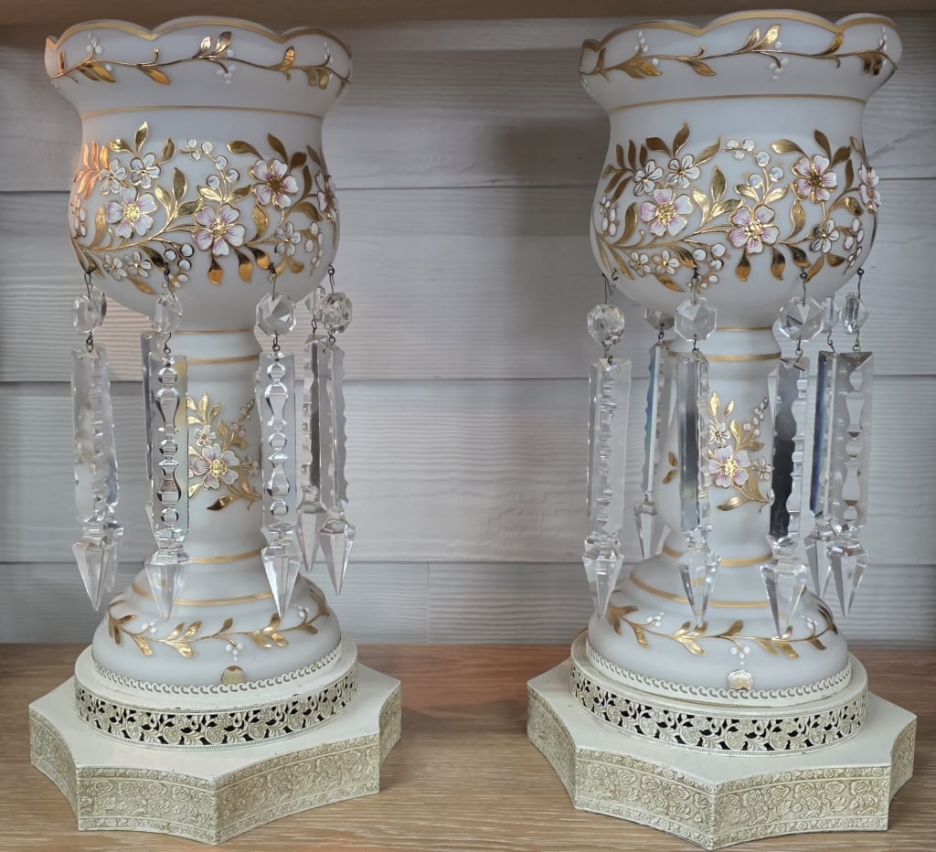Pair Vintage Victorian Style Mantle Luster Lamps: Pair of vintage Victorian style mantel luster lamps. Lamps feature satin glass shades with scalloped rims, hand painted flowers, and gold leaf highlights. Adorned with hanging "spear-cut" prisms. In w