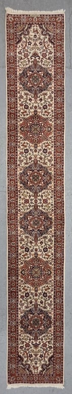 Vintage Hand Knotted Persian Runner Rug: Vintage hand knotted wool pile Persian runner rug. Rug features intricate floral medallions and classic red and ivory color palette. In good condition. Approximately 15' x 31"w. Photos are considered 