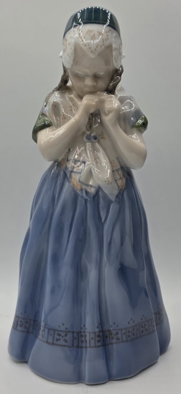 Vintage Royal Copenhagen "Girl From Bornholm": Vintage Royal Copenhagen figurine. Designed by Lotte Benter. Depicts a "Girl from Bornholm" in traditional regional costume. Model number 1323. In great condition with no chips or cracks. Approximatel