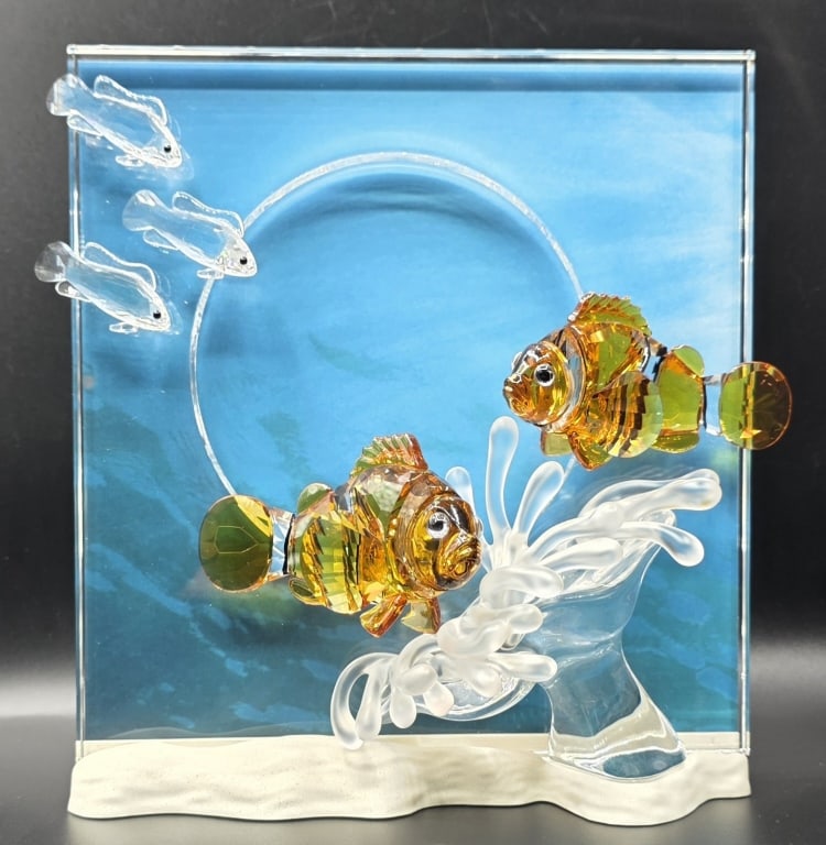 Swarovski Wonder of the Sea "Harmony" Figurine: Swarovski Wonders of the Sea "Harmony" figurine from the 2005 Annual Edition. Features two vibrant clownfish crafted from topaz crystal swimming beside a matte frosted crystal sea anemone and a small 