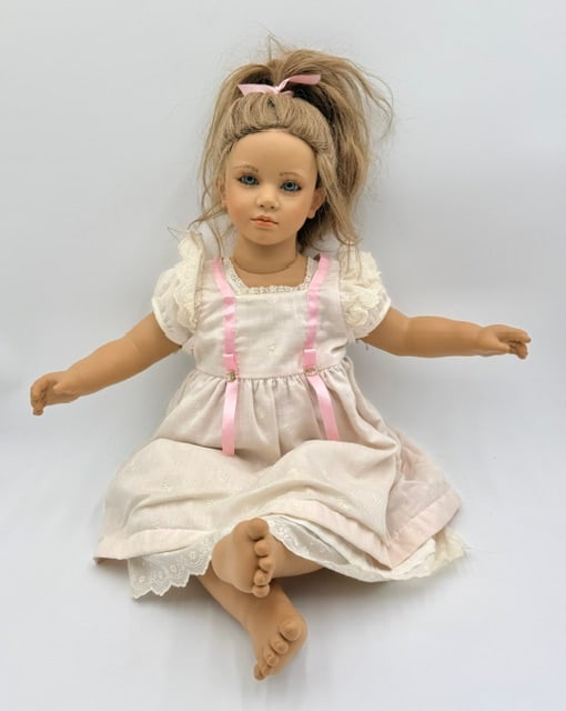 26" Annette Himstedt "Fiene" Baby Doll: 26" Annette Himstedt "Fiene" baby doll. From the 1990/91 "Barefoot Babies" collection. Vinyl doll features blonde hair, blue eyes, and is designed to be barefoot, often representing children from diff