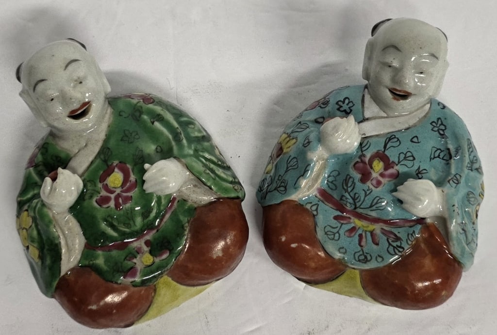Pair Vintage Chinese "Laughing Boy" Wall Pockets: Pair of vintage Chinese "Laughing Boy" porcelain Ho-Ho Er Xian wall pockets. Hand painted Famille Verte style. The boys are depicted in seated positions with joyful, animated expressions with floral p