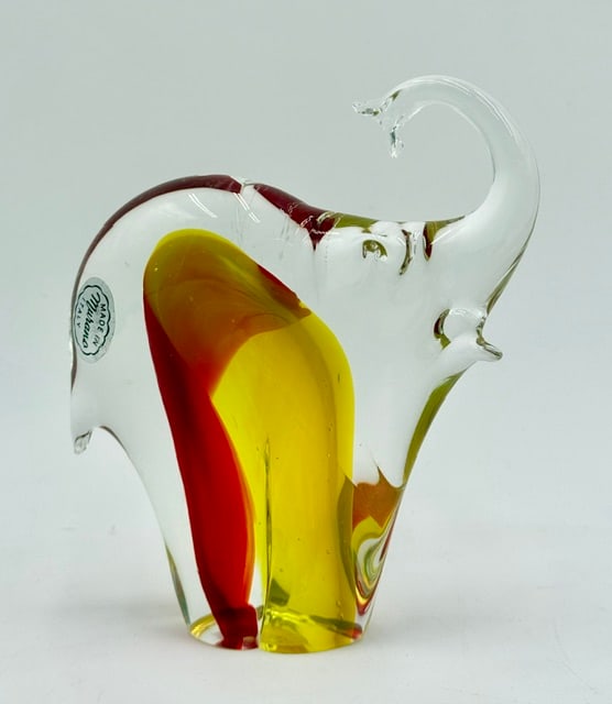 Beautiful Murano Art Glass Elephant Sculpture: Beautiful Murano art glass elephant sculpture. Made in Italy. Elephant features clear glass with red and yellow interior elements. Excellent condition with no chips or cracks. Approximately 6"h x 5"w 