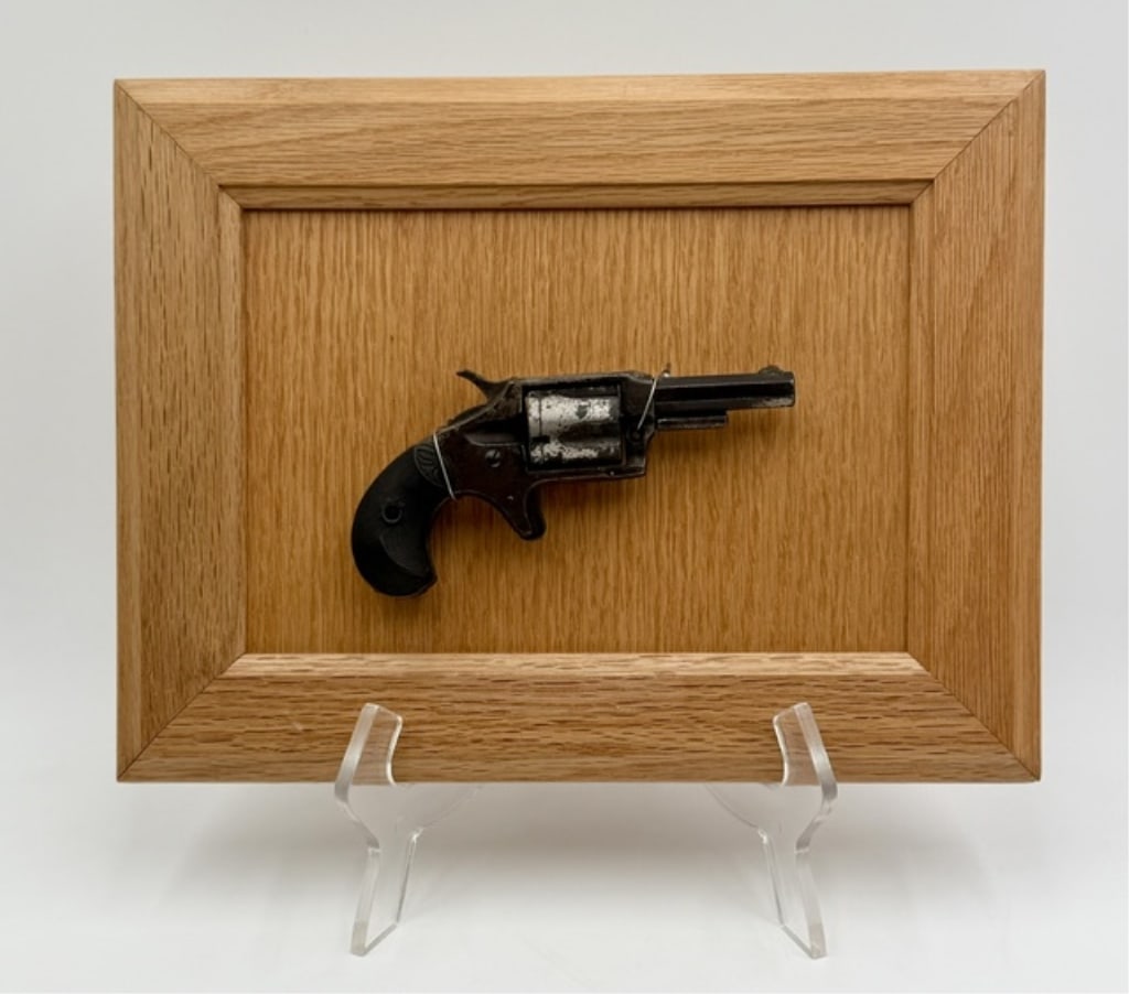 Lee Arms Co. "Red Jacket" Revolver Wall Display: Antique Lee Arms Co. "Red Jacket" spur trigger pocket revolver mounted on wooden wall display. Firearm produces between 1877 and 1880. Revolver has not been removed from backing. Please ask any questi