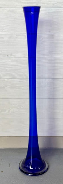 Stunning Cobalt Blue Art Glass Floor Vase: Stunning cobalt blue art glass floor vase. Made in Poland. Vase features a wide, funnel shaped base and a tall, slender neck reminiscent of mid-century art glass designs. In excellent condition with n