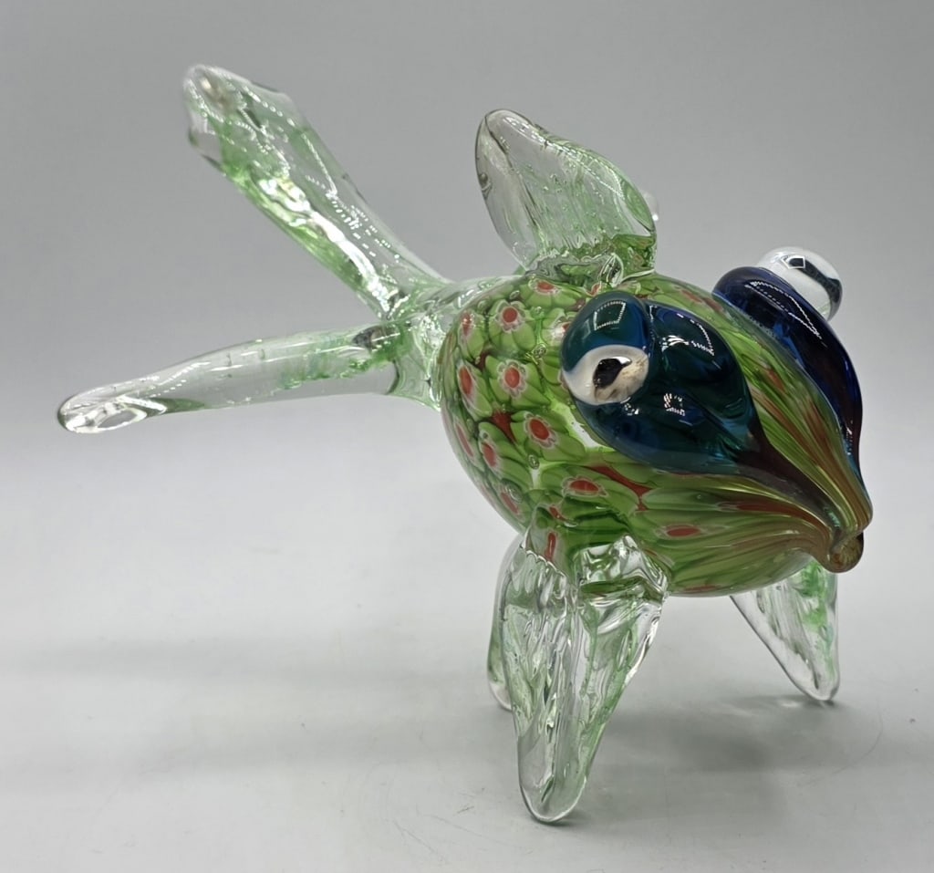 Handblown Art Glass Betta Fish: Handblown art glass betta fish. Fish features a vibrant green translucent body detailed with red speckles and large stylized dark blue eyes. In excellent condition with no chips or cracks. Approximate