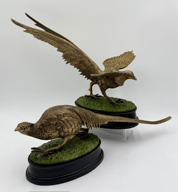 Pair of Brass Pheasant Figurines: Pair of brass pheasant figurines. Made of cast brass with a green painted base designed to resemble grass. Bottoms marked D? 4. Includes 12.25"h x 16"l x 8.25"w bird and 6.25"h x 19"l x 5"d bird. Phot