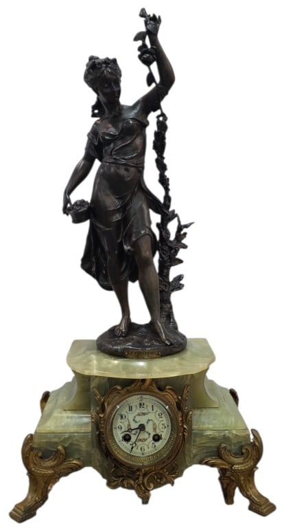 Beautiful Antique French Mantle Clock: Beautiful antique French mantle clock. Clock features Le Printemps (Messenger of Spring) statue signed on base Emile Bruchon. The base and clock housing are carved out of a green onyx, accented with o