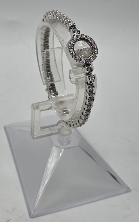 Tous 18k Kaleidoscope Diamond Tennis Bracelet: Tous 18k kaleidoscope shaker diamond tennis bracelet. 25.95g TW. Bracelet consists of 40 brilliant cut diamonds set in 18k white gold connected by a round kaleidoscope shaker center containing accent 