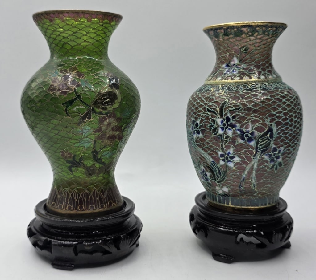 Pr. Chinese Plique-a-jour Cloisonne Enamel Vases: Set of two Chinese plique-a-jour cloisonne enamel vases. Featuring a delicate floral and bird design with translucent panels and intricate metal wirework. Includes two wooden bases. Approximately 4.25