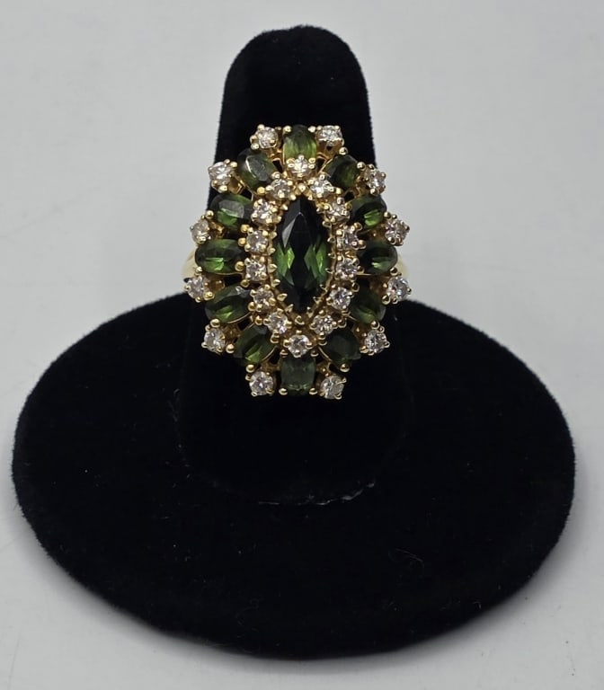 Stunning 14k Tourmaline & Diamond Ring - 9.44g: Stunning 14k yellow gold tourmaline and diamond ballerina ring. Ring features a large marquise cut green tourmaline surrounded by 12 smaller marquise cut tourmalines and 26 round diamonds set in 14k y