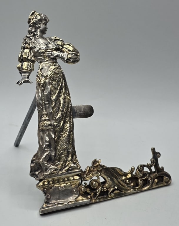 Figural Sterling Menu/Place Card Holder 4.255oz: Vintage figural sterling silver menu/place card holder. Holder features highly detailed figural piece depicting a Renaissance woman. Approximately 5.5"h x 4"w and 4.255oz. Photos are considered part o