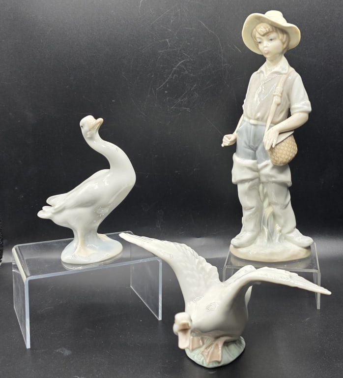 3pc Collectible Lladro Porcelain Figurines: 3pc Collection of collectible Lladro porcelain figurines. Includes 9" Going Fishing, 3" Goose Taking Flight, and 4.5" small goose. All made in Spain and hand painted. Photos are considered part of the