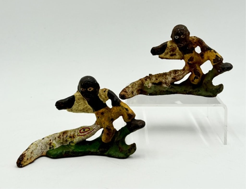 Antique Cast Iron Black Americana Bottle Openers: Pair of antique Black Americana bottle openers. Made of cast iron with a painted finish. In good condition for age with normal paint loss. Approximately 2.5"h x 4"l x 1"d. Photos are considered part o