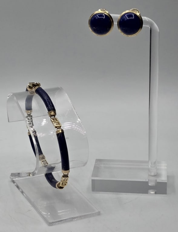 14k Blue Lapis Bracelet and Earrings: 14k Blue lapis bracelet and earrings. Vintage 14k gold bracelet featuring cylindrical lapis lazuli gemstones linked by Greek key designed stations in 14k yellow gold. Approx. 7.5" L and 9.39g TW. 14k 
