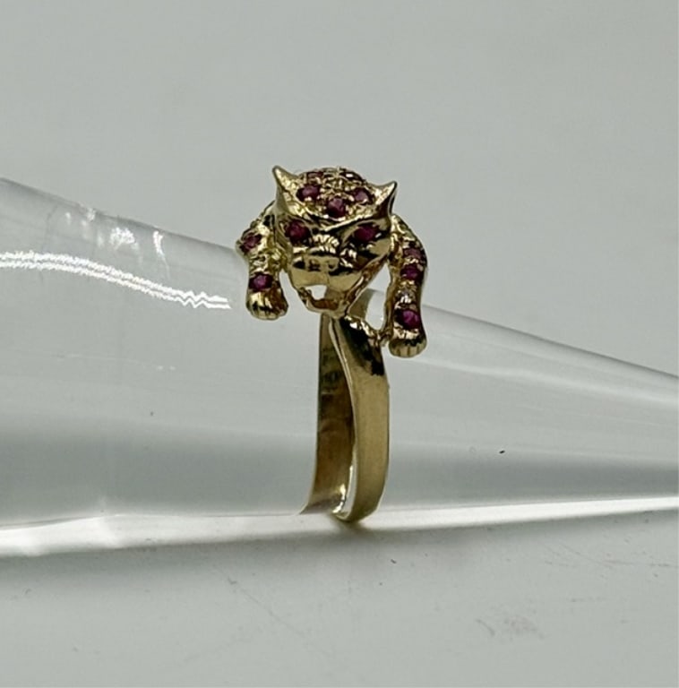 14k Diamond & Ruby Panther Ring - 3.15g: 14 Yellow gold panther ring. Ring features numerous pave set diamond and rubies and accented ruby eyes. Approximately 3.15g and size 7.5. Photos are considered part of the condition and description. 5