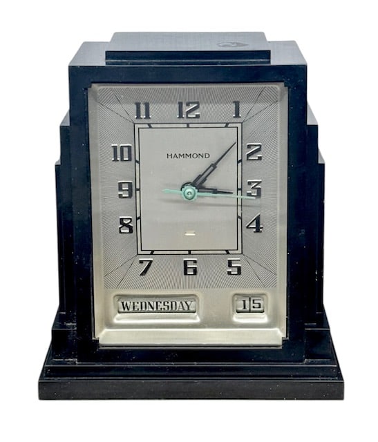 Hammond "Gregory" Skyscraper Bakelite Clock: Vintage Hammond "Gregory" Skyscraper Bakelite Art Deco Clock. Features A Distinctive Art Deco "skyscraper" Silhouette With A Black Bakelite Case. Electric Clock Includes A Metal Face With Green And Bl