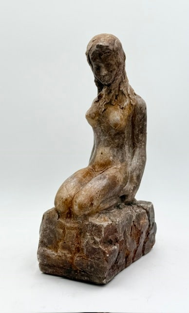 MC Kneeling Female Nude Sculpture: Mid Century kneeling female nude sculpture. Sculpture features a weathered or stained finish, enhancing the detailed texture of the hair and body. Some chips present. Believed to be made of cast plast