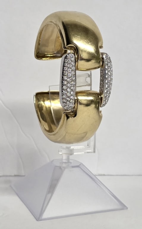 Wempe 18k Diamond Cuff Bracelet 108.37g TW: Stunning Wempe 18k diamond cuff bracelet. Crafted from 18k yellow gold with white gold pave settings. Domed cuff style design held together by a central buckle like stirrup element encrusted with diam
