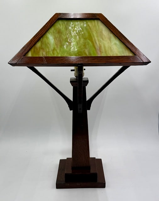 Mission Oak Style Arts & Crafts Slag Glass Lamp: Vintage mission oak style arts and crafts table lamp. Constructed from quarter sawn mission oak and integrated with a four panel green slag glass shade. Some natural age wood imperfections present in