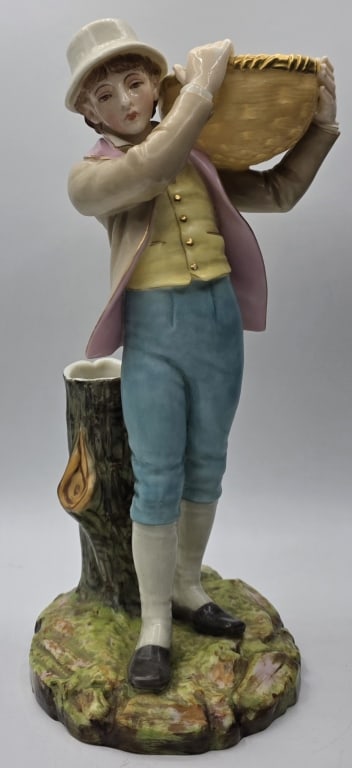 Vintage Royal Worcester Porcelain Figural Bud Vase: Vintage Royal Worcester porcelain figural spill holder bud vase. Depicts a country boy carrying a basket. In excellent condition for age with no chips or cracks. Approximately 10"h. Photos are conside