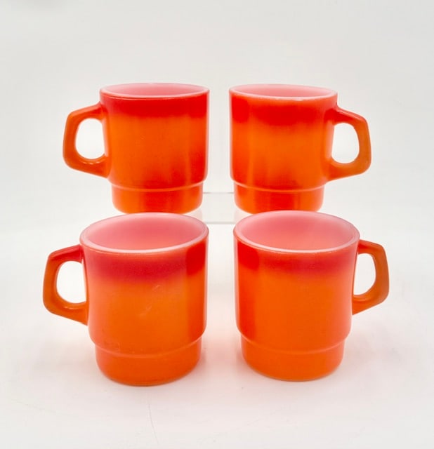 Vintage Fire King Milk Glass Stacking Mugs: Vintage Anchor Hocking Fire King milk glass stacking mugs. Mugs feature a unique stepped base design that allows them to securely stack on top of one another to save cabinet space. Retro flame orange 