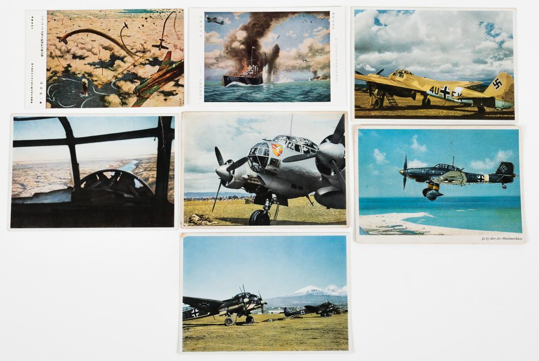 WWII GERMAN & JAPANESE AIR FORCE POSTCARDS (7): Good lot of seven (7) WWII postcards, including two rare Japanese color postcards showing Japanese fighter planes attacking ships, 5.5 x 3.5 in., and five German color postcards showing various planes