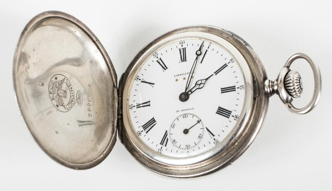 WATCH OF HANS BAUR, HITLER'S PERSONAL PILOT: Hans Baur (1897-1993) SS officer and Adolf Hitler's personal pilot and leader of the Reichsregierung squadron. Offered here is a rare personal relic, Hans Baur's personal silver pocket watch, a Longin