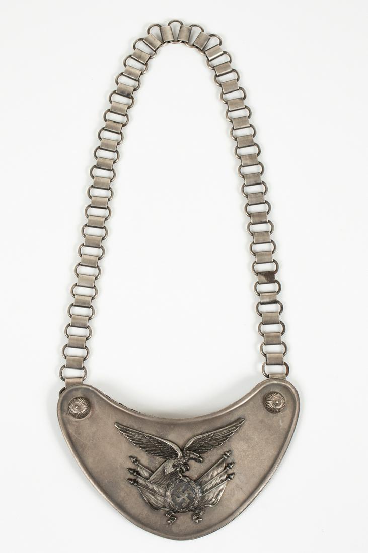 WWII LUFTWAFFE STANDARD BEARER'S GORGET: Rare German WWII Luftwaffe regimental standard flag bearers gorget and neck chain. Measures approximately 6.75 x 4 in., the steel chain is approximately 24 inches long. The front shows a fine detailed