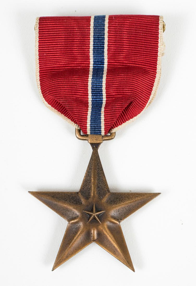 WWII NAMED U.S. BRONZE STAR BATTLE AXE REGIMENT: WWII U.S. Army named Bronze Star with ribbon, identified to PFC Robert W. Edwards, with 'Battle Axe Regiment', the 272nd Infantry of The Fighting 69th Infantry Division. Machine engraved, slot brooch.