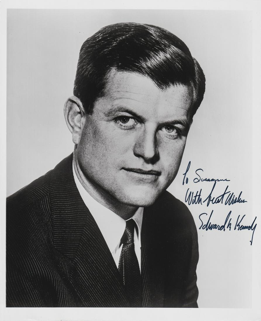 EDWARD KENNEDY: (1932 - 2009) Democratic senator from Massachusetts, brother of John F. Kennedy and Robert Kennedy. Signed 8 x10 in. b/w photograph, chest up portrait of Kennedy in a dark suit. He signs at lower righ