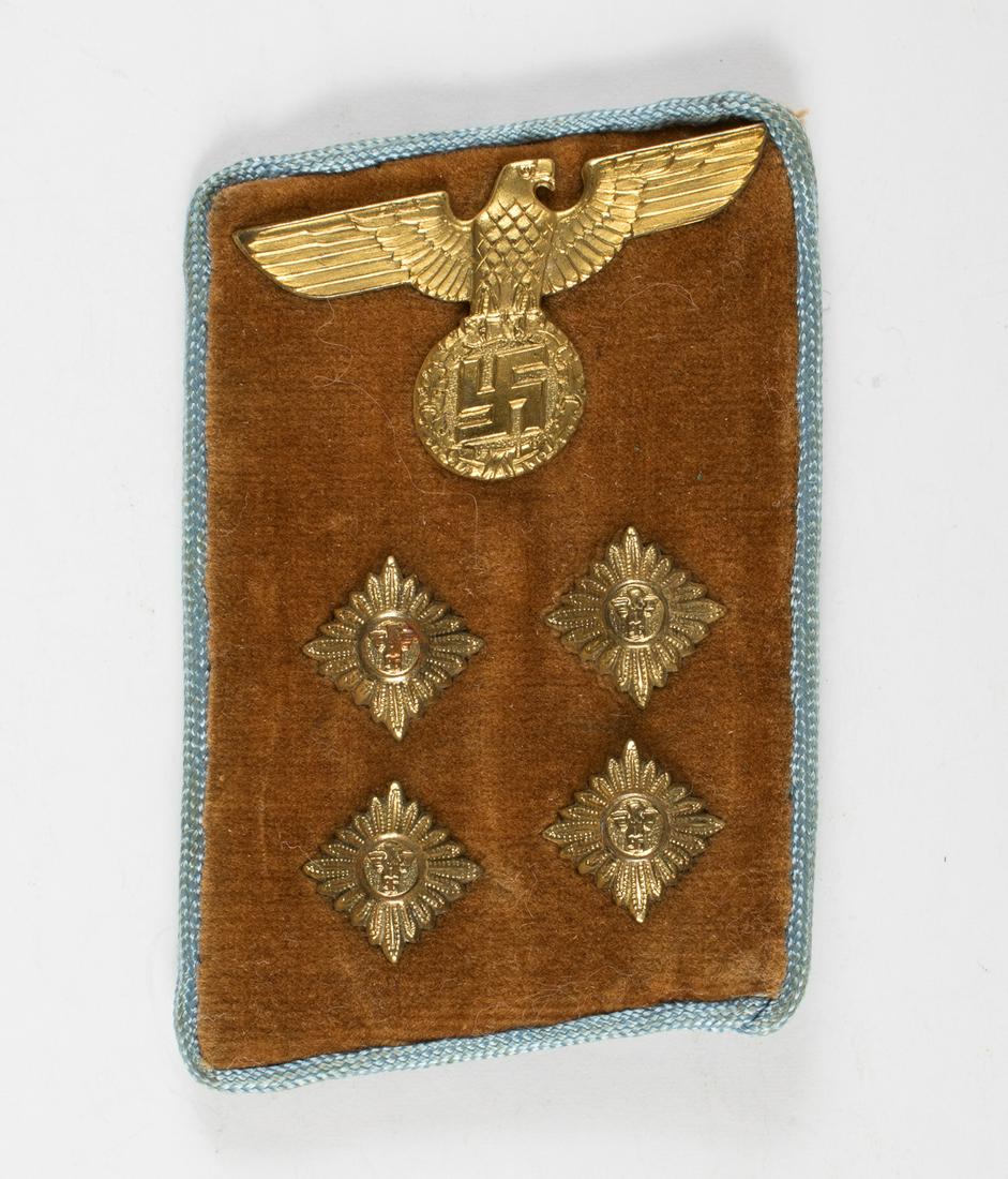 NSDAP ORTS LEADER GEMEINSCHAFTSLEITER COLLAR TAB: NSDAP ORTS LEADER GEMEINSCHAFTSLEITER COLLAR TAB NSDAP Orts Gemeinschaftsleiter (Community leader) collar tab, light brown velvet over buckram, light blue piping, four pips, paper remnant on back, app
