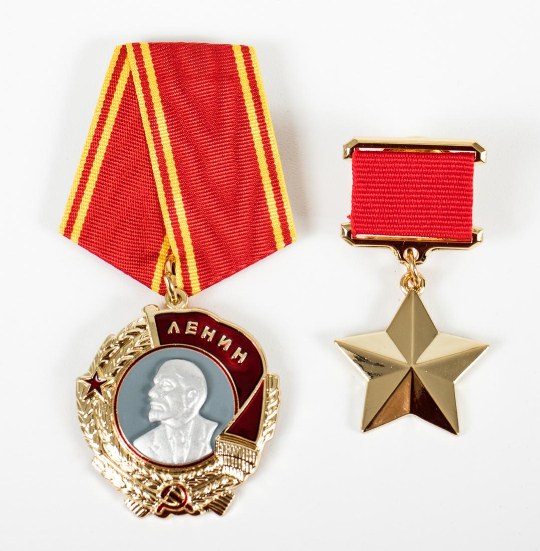 SET OF HERO OF THE SOVIET UNION MEDALS: SET OF HERO OF THE SOVIET UNION MEDALS Lot of two (2) Soviet badges: â€˜The Golden Starâ€™ (1 in., 2.25 in. with ribbon), and the â€˜Order of Leninâ€™ (1.5 in., 3.5 in. with ribbon).