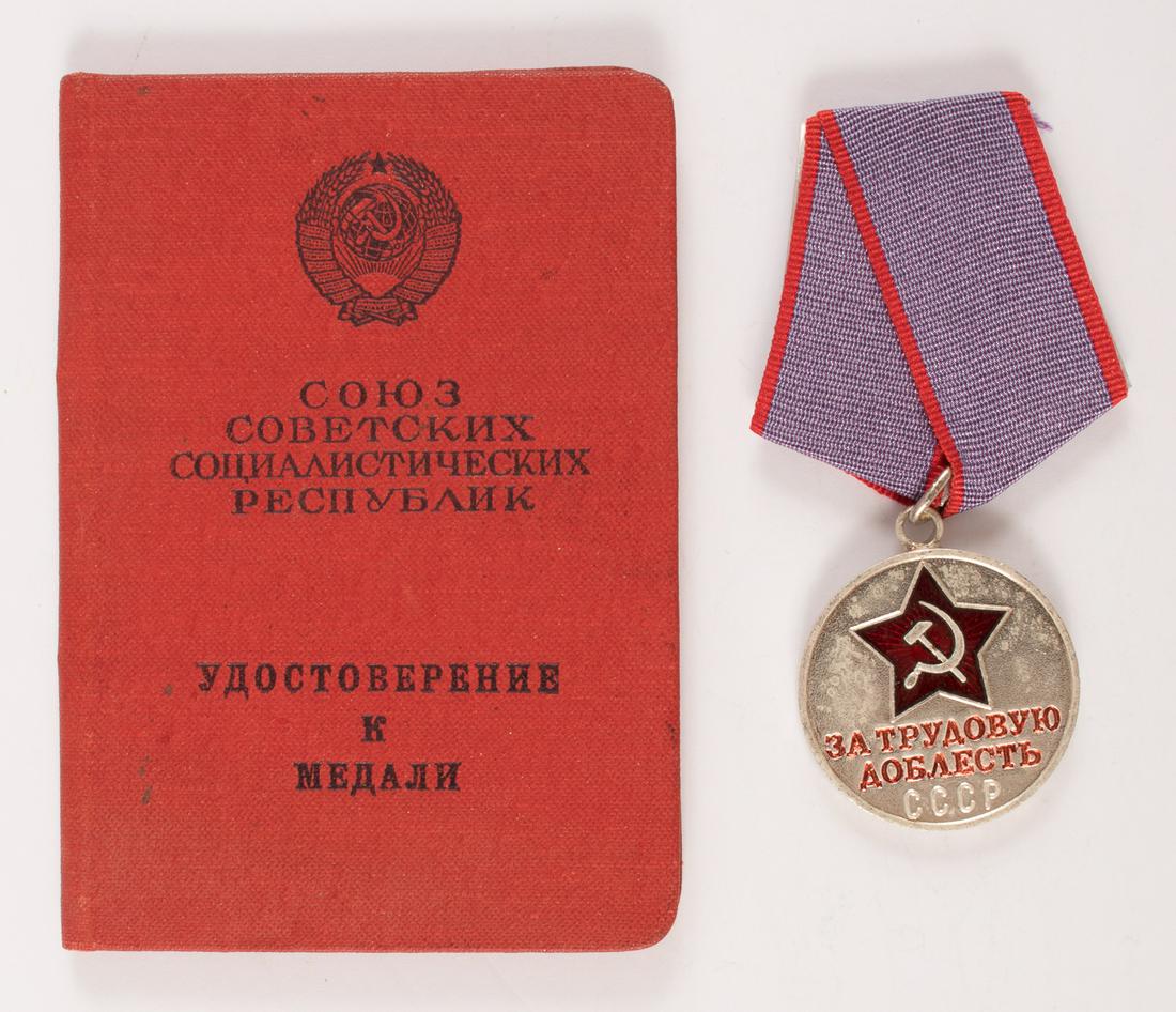 SOVIET MEDAL 'FOR LABOR VALOR' W/ CERTIFICATE: SOVIET MEDAL 'FOR LABOR VALOR' W/ CERTIFICATE Soviet civilian medal 'For Labor Valor' 34mm diameter, secured by a ring through the medal suspension loop to a standard Soviet pentagonal mount covered b