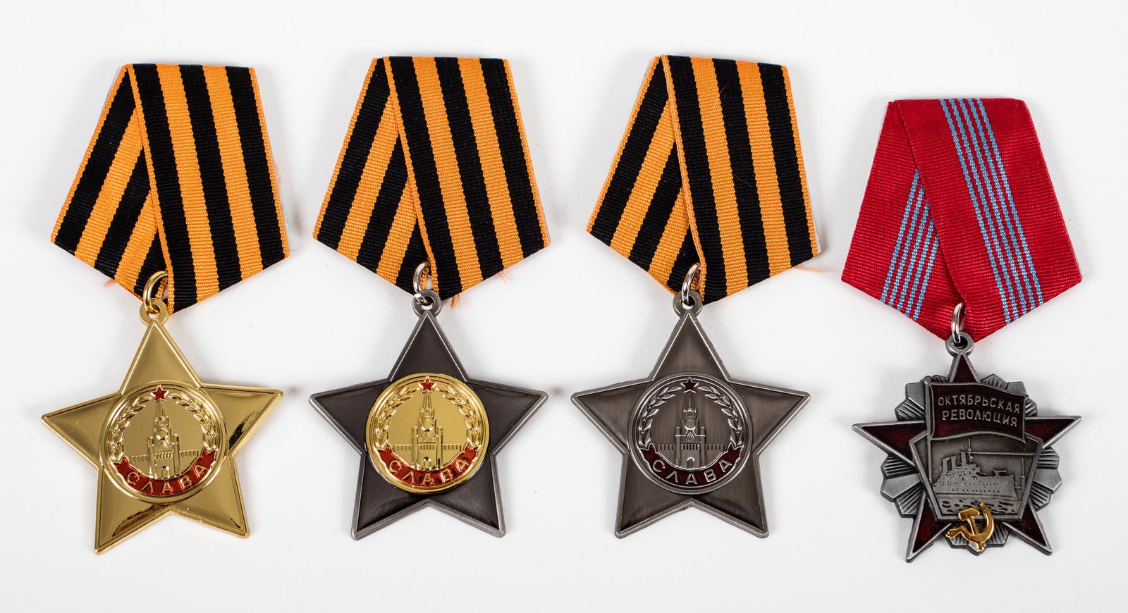 SOVIET ORDER GLORY & OCTOBER REVOLUTION (4): Soviet complete medal set of 1st, 2nd, and 3rd Class Order of Glory. Back marked 'CCCP' With 'Order of October Revolution' medal. All medals complete with the ribbon. Well made copies of the originals