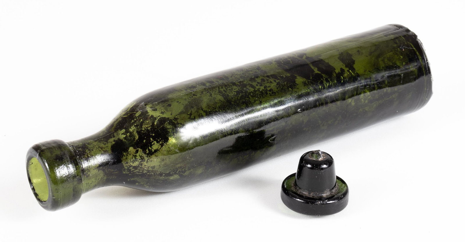 WWI GERMAN GAS BOMB BOTTLE CLARK: Original German gas bottle that contained toxic gas to be used in chemical warfare during 1917. This green glass bottle, 7.5 x 1.75 inches, contained a fluid with a color varying from eggwhite to brow