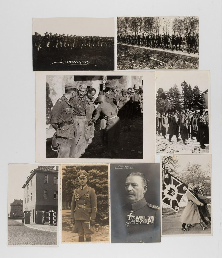 GERMAN WWII PHOTOGRAPHS (8): GERMAN WWII PHOTOGRAPHS (8) Group of eight (8) b/w photographs of German soldiers, seven miscellaneous photographs showing POW's, marching soldiers, one with a soldier carrying a large standard flag, 