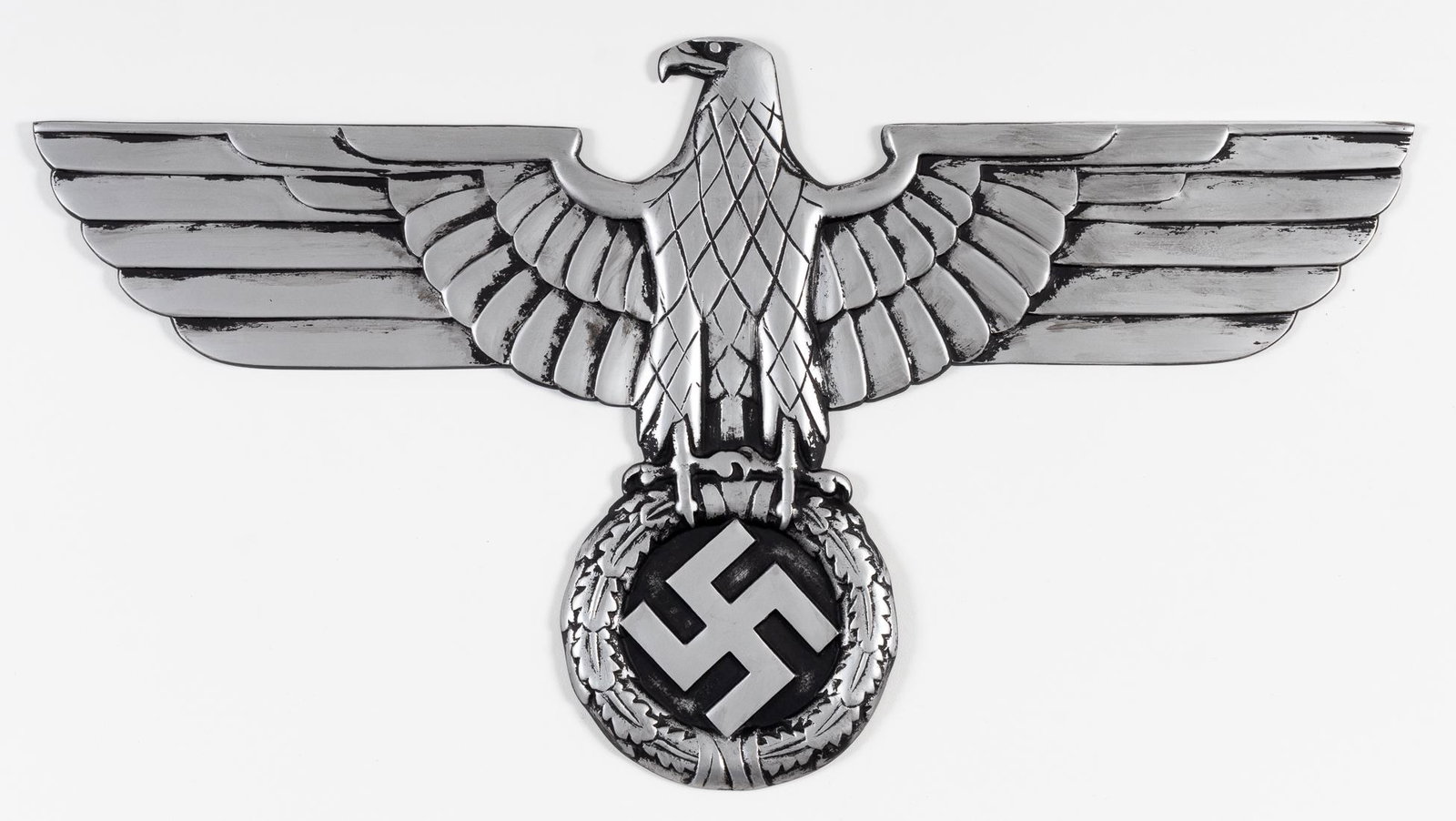 GERMANN RAILWAY EAGLE: GERMANN RAILWAY EAGLE German WWII railway eagle with a 27.5 wingspan by 15 inches tall. Blackened cast aluminum front, with four threaded mounting holes on the back. As-is.