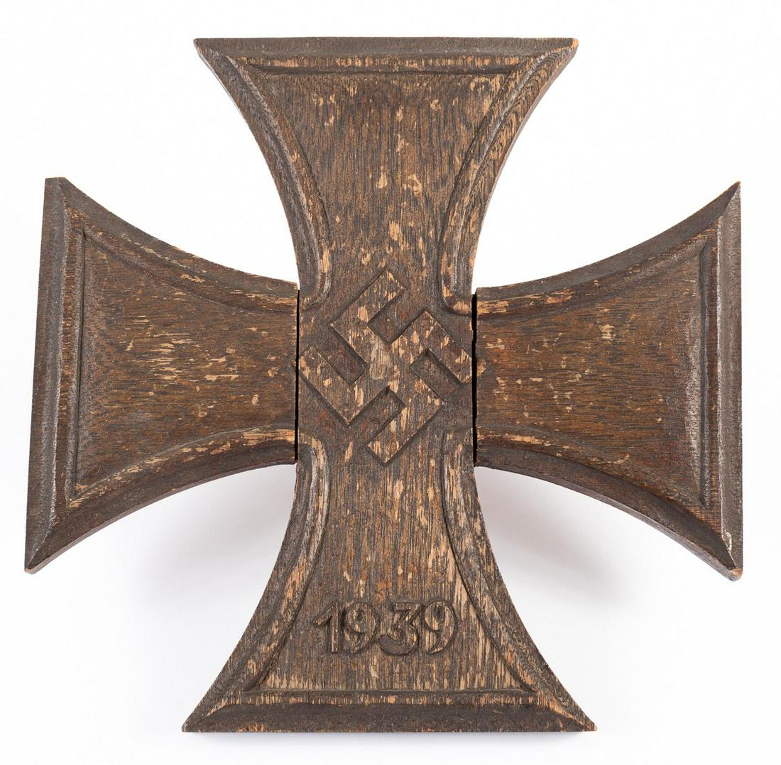 LIBERATED WWII GERMAN GRAVE MARKER: LIBERATED WWII GERMAN GRAVE MARKER Wooden grave marker in the shape of an Iron Cross, carved with a mobile swastika and '1939' on the lower arm. A fine relic, according to family members Mr. H. Gray, 