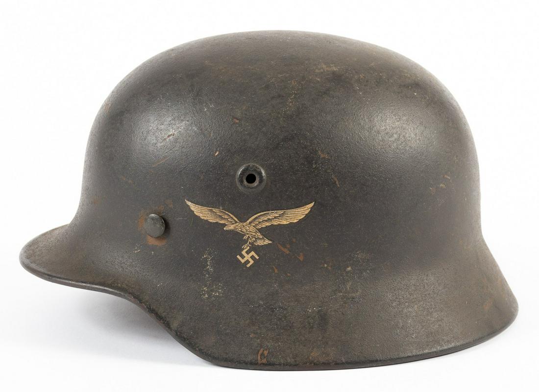LUFTWAFFE M40 DOUBLE DECAL HELMET: LUFTWAFFE M40 DOUBLE DECAL HELMET German WWII Luftwaffe M40 double-decal helmet, paint looks to be original, with leather liner. The shell is stamped 'Q64' on the left side, and N176 in the rear. Nati