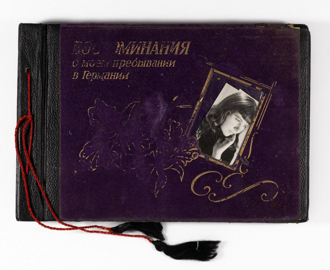 RUSSIAN SOLDIER IN EAST GERMANY PHOTO ALBUM: Photo album belonging to Russian soldier stationed in East Germany during the 1960s-70s period, with one hundred and six b/w photos of soldiers in full uniforms and his comrade images of tanks and dra